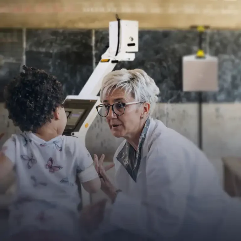 A doctor is examining a child in difficult environment