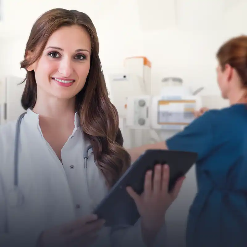 A female doctor holding a tablet